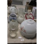 A large job lot of assorted vintage glass lamp shades