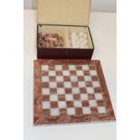 A vintage alabaster chess set & board