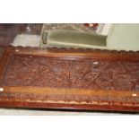 An ornately carved coffee table with brass inlay Collection Only