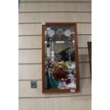 A vintage hand painted bevelled edged mirror
