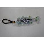 A Chinese jade tassel with celadon coloured beads