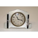 A hallmarked silver Art Deco period alarm clock with enamel decoration (damage to enamel work)