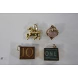 Four 9ct gold charms 9.0 grams total weight