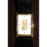 A Credit Suisse gold ingot watch (with slight wear)
