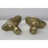Two heavy brass elephant heads (from a closed pub) used to support the foot rail