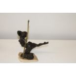 A bronze & resin female archer figurine