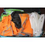 A suitcase full of assorted garment/suit carriers