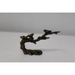 A small bronze study of birds on a branch. 10cm x 6cm