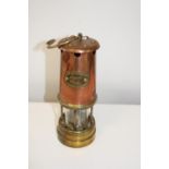 A lamp & limelight brass & copper miners lamp