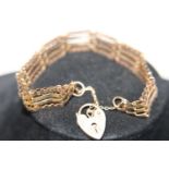 A 9ct gold gate bracelet with padlock clasp 9.1 grams