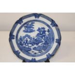 A antique Chinese blue & white plate with slight damage to the edges. Unusual mark to the reverse.