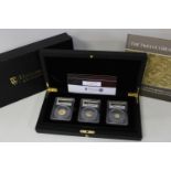 A limited edition set of three 22ct gold proof coins produced by Hatton's of London to mark the