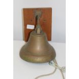 A mounted brass bell