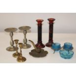 A selection of assorted candlesticks etc