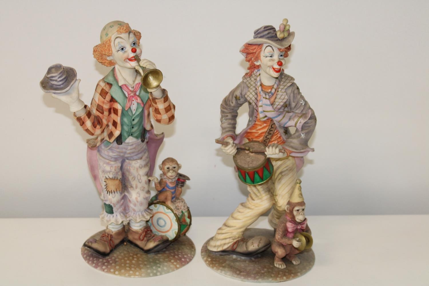 Two Leonardo clown figures Height 36cm (as found)
