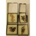 Four boxed high quality costume jewellery brooches