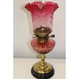 A Hink's duplex pink glass oil lamp. Height 56cm