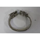 A white metal dragon head bangle