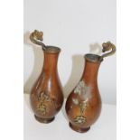 A pair of Chinese bronze bat vases with calligraphy & impressed marks to the base (sold as seen)