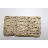 A late 18th early 19th century Chinese ivory card case superbly carved with every day scenes of