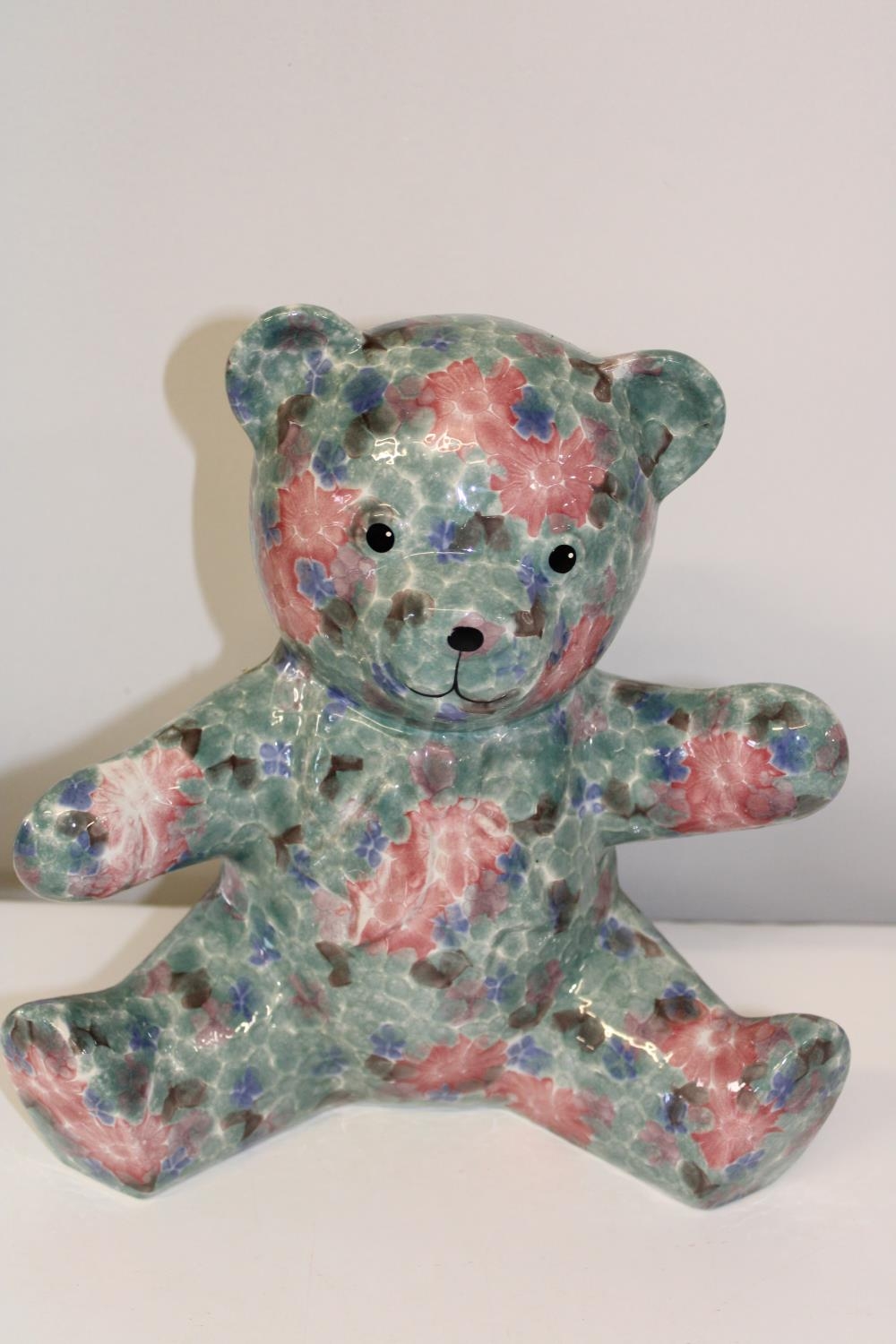 A large ceramic teddy bear. Height 28cm