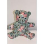 A large ceramic teddy bear. Height 28cm