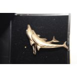 A 9ct gold double dolphin brooch