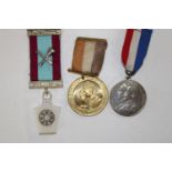 Three assorted medals