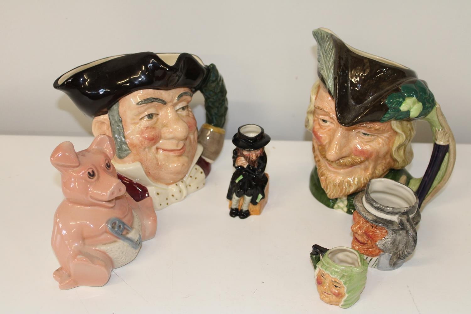 A selection of Royal Doulton toby jugs & other ceramics