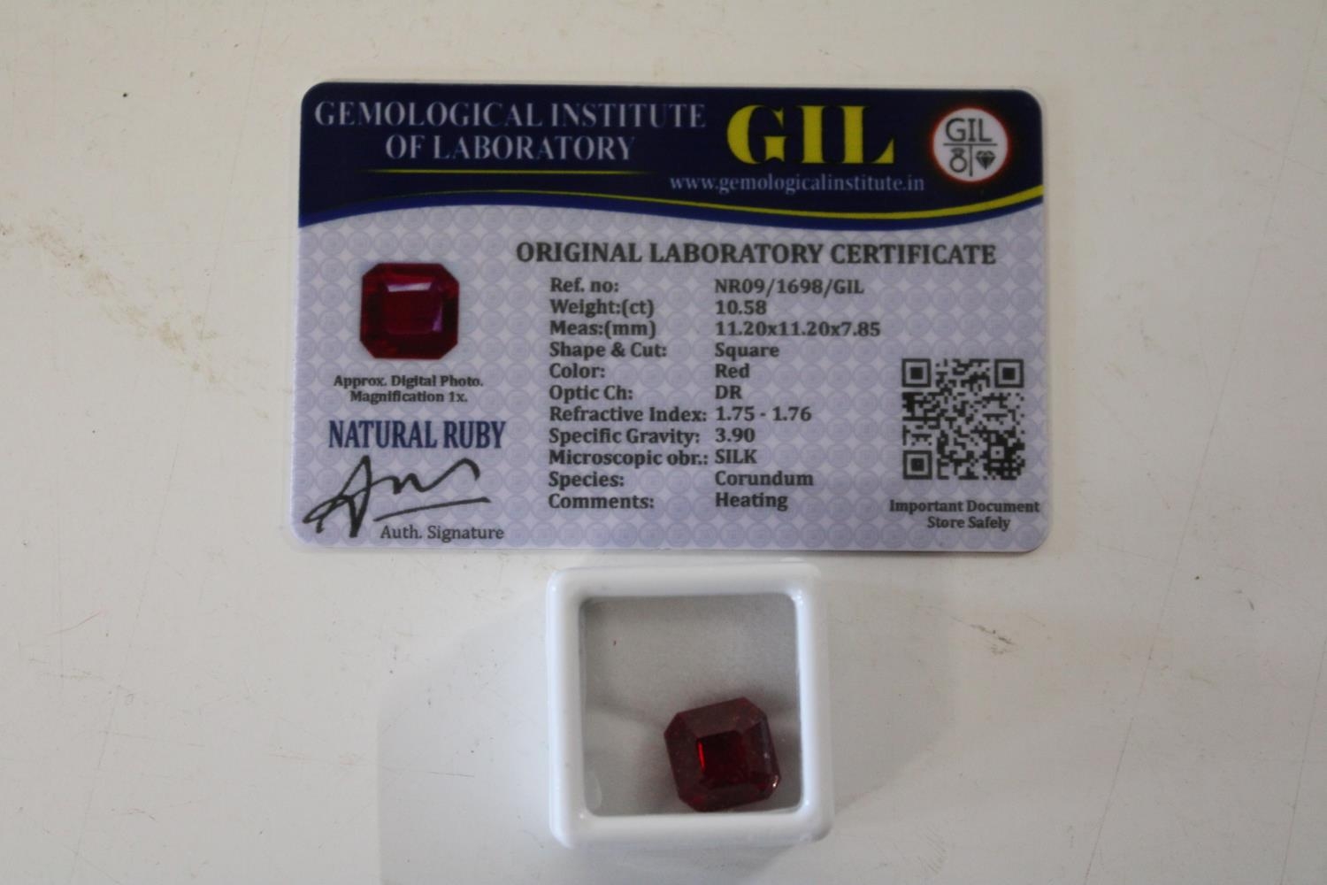 A Ruby gemstone & certificate