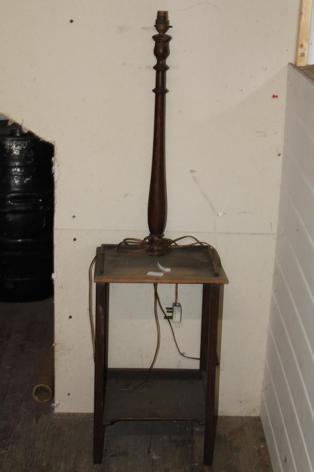 A vintage wooden lamp table