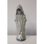 A Nao figure of a boy & his dog Height 28cm