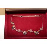 A 925 silver ornate tricolour amber necklace