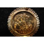 A 1982 22ct gold half sovereign in a 9ct gold mount total weight 5.8 grams