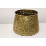 A late 18th early 19th century Persian brass bowl with incised decoration & inscription to centre.