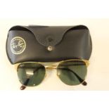 A pair of genuine gold tone framed Ray Ban signet sunglasses in the original case
