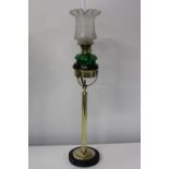An unusual brass & glass oil lamp. Height 76cm