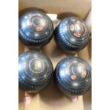 A set of four vintage Green Master lawn bowls