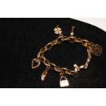 A rolled gold charm bracelet