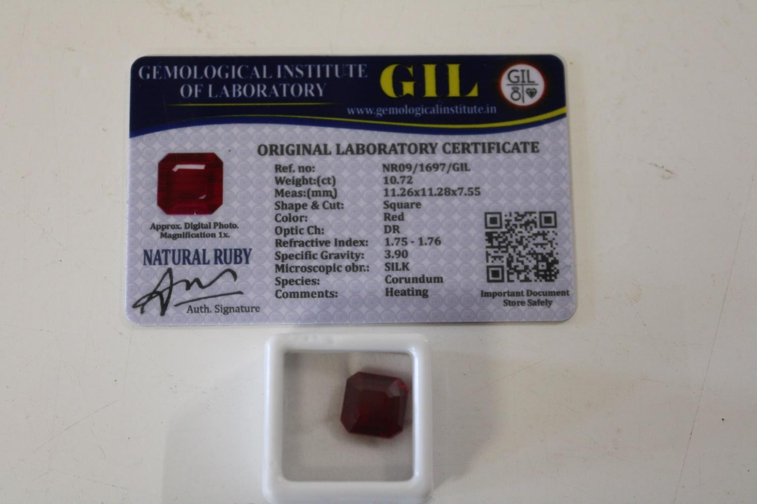 A Ruby gemstone & certificate