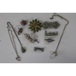 A selection of vintage brooches including a 925 silver Viking brooch etc