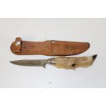 A Swiss knife with a deers foot handle & leather sheath 22cm in length