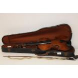 An antique cased violin. Sold as seen