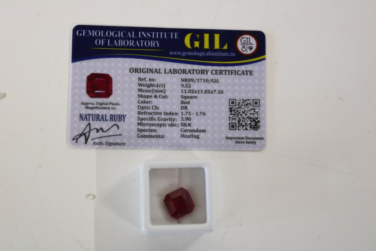 A Ruby gemstone & certificate