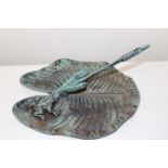 A metal sundial in the form of a frog on a lily pad 26cm x 23cm