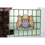 A antique Leaded stain glass panel depicting the Leeds coat of arms (As found) 68cm x 55cm