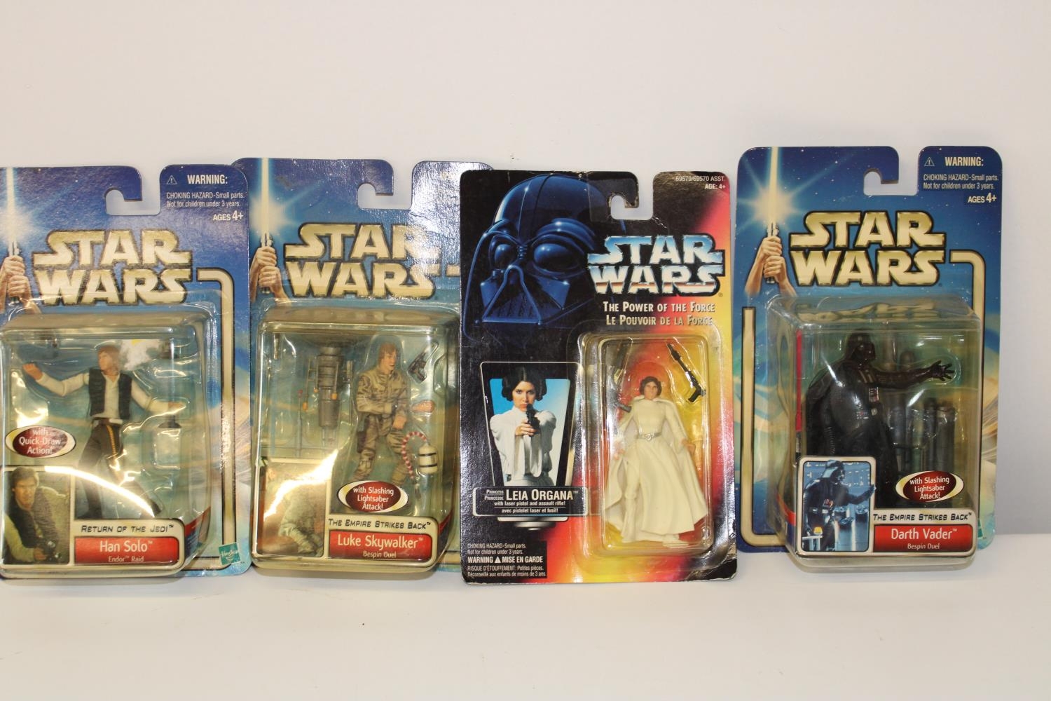 Four boxed Star Wars figures