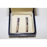 A pair of Royal Mint silver & diamond earrings