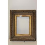 An antique wooden & plaster picture frame (as found) 44cm x 52cm