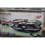 A boxed raclette grill